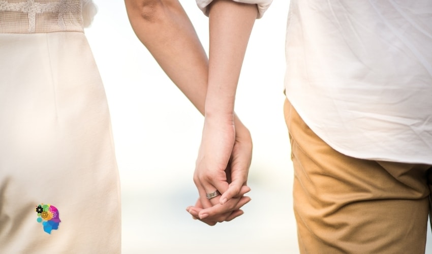 A couple holding hands in a relationship about Relationship Red Flags