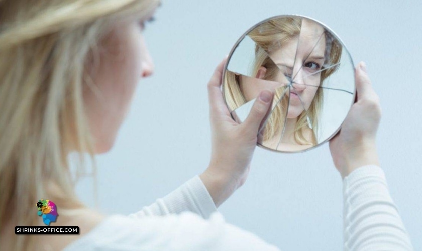 A woman examines a fragmented reflection of herself in a broken mirror, symbolizing the complex journey of healing and self-reflection in the process of how to overcome self-hatred and build self-love.
