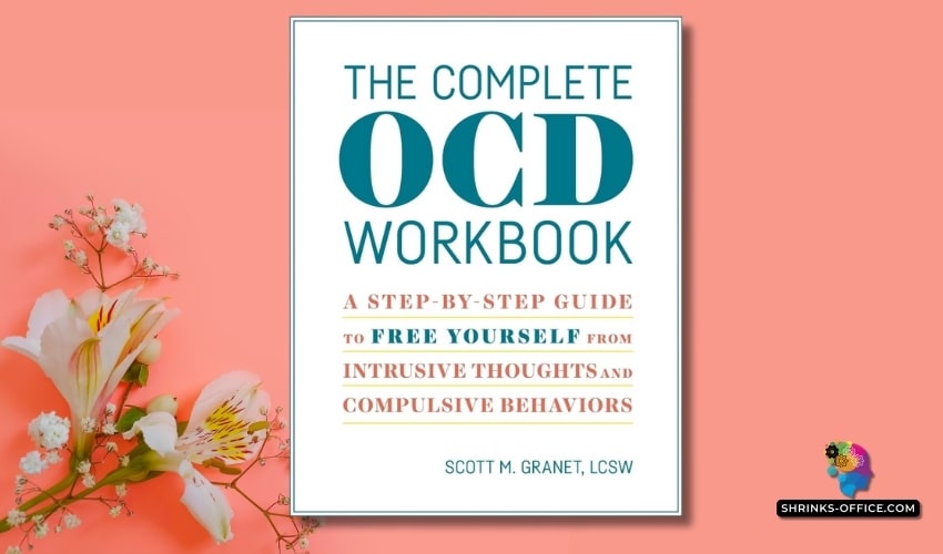 The cover of 'The Complete OCD Workbook' by Scott M. Granet, LCSW, displayed alongside blooming white flowers on a soft coral background.
