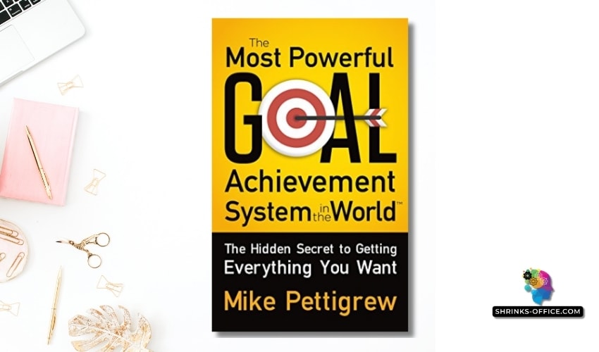 Cover of 'The Most Powerful Goal Achievement System in the World' by Mike Pettigrew, featuring a dartboard with a goal icon on a vibrant yellow background.